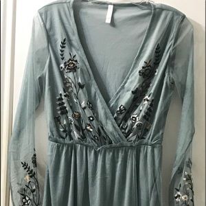 I am selling a teal, long sleeved dress.